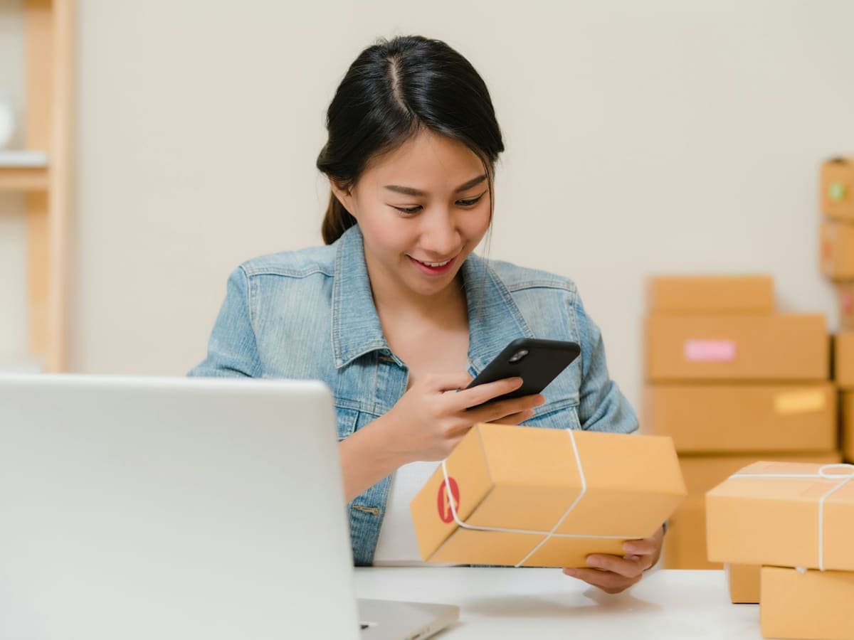 An online shop owner preparing customer orders